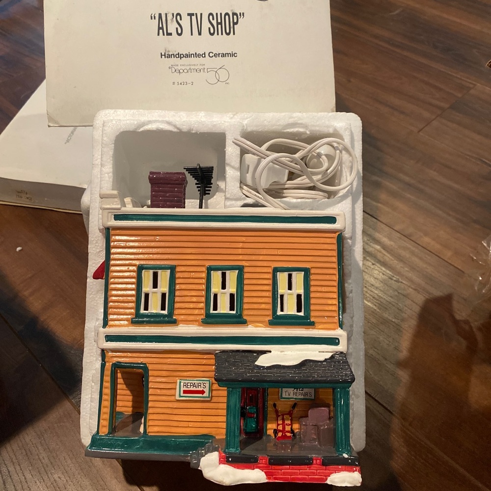 Retired Department 56 “Al’s TV Shop”